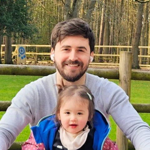 Alex Hawke with his daughter
